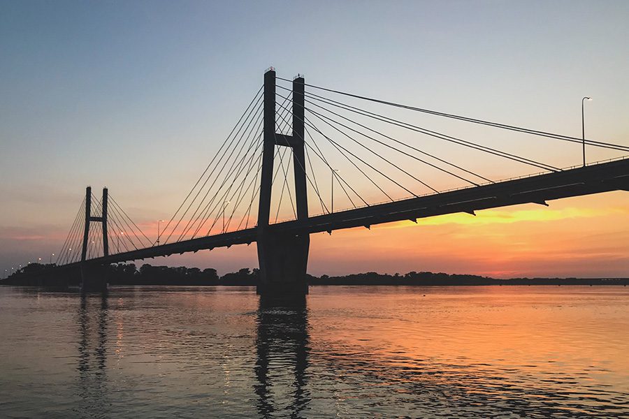 Quincy, IL - Long Distance View of the Quincy Illinois Memorial Suspension Bridge at Sunset Over the Mississippi River